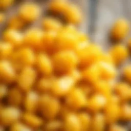 A handful of yellow raisins showcasing their natural texture